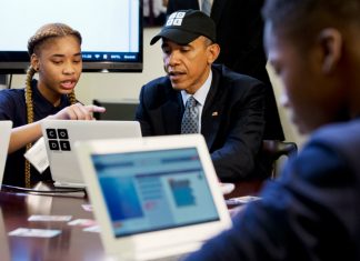 President Obama learns to write code alongside student Adrianna Michell in Newark, NJ.