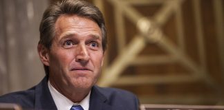 Senator Jeff Flake files a resolution on Tuesday to repeal a set of rules approved last October by the FCC