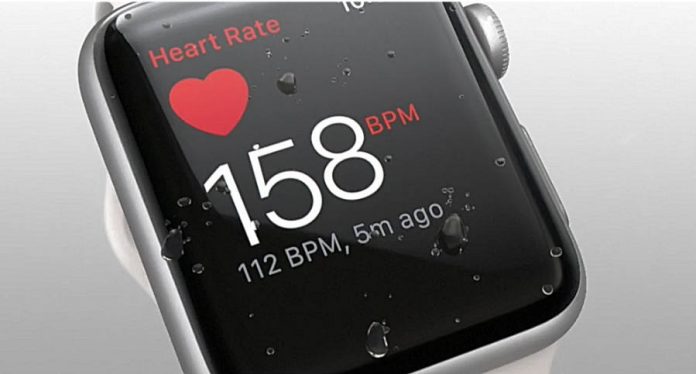 Apple Watch 2 with the heart rate app on screen.