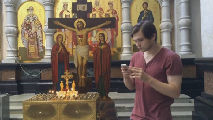 Ruslan Sokolovsky playing Pokemon Go in a Russian church