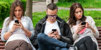 People staring at smartphones