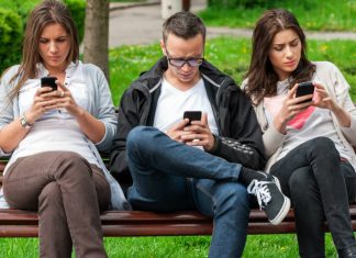 People staring at smartphones