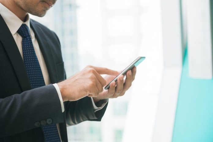 Man Working on Mobile Phone