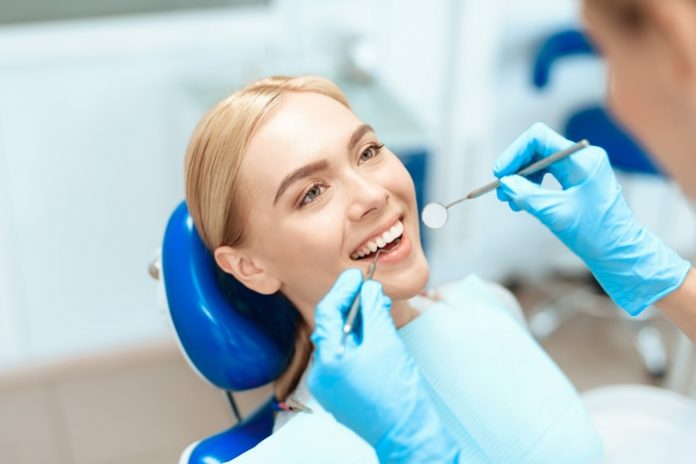 Woman Getting Dental Treatment