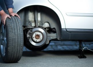 Mechanic Changing Old Tire